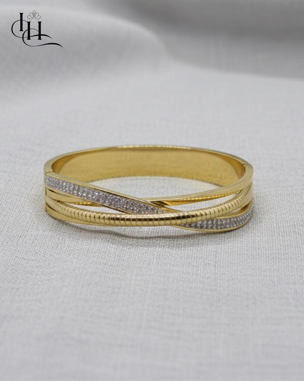 Elegant Dual-Tone Crossover Gold and Diamond Bangle