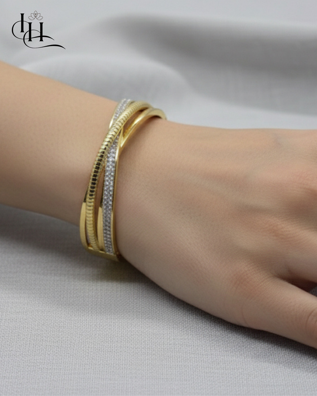 Elegant Dual-Tone Crossover Gold and Diamond Bangle